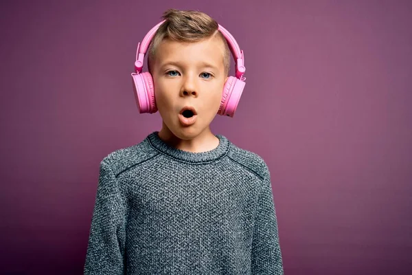 Young Little Caucasian Kid Wearing Headphones Listening Music Purple Background — Stock Photo, Image