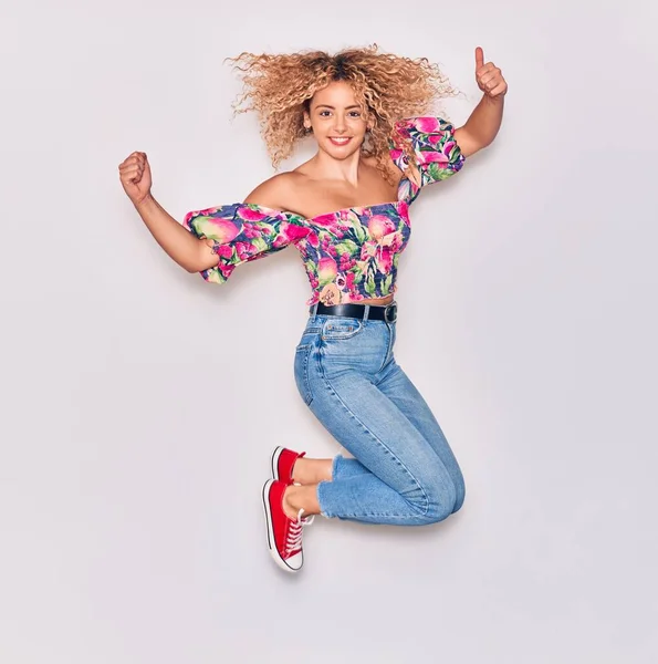 Young Beautiful Curly Girl Wearing Casual Clothes Smiling Happy Jumping — Stock Photo, Image