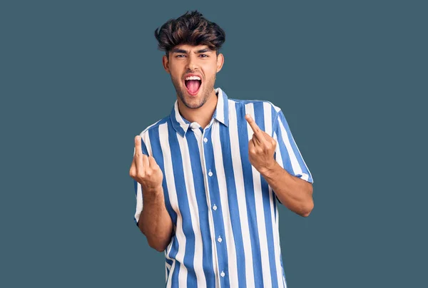 Young Hispanic Man Wearing Casual Clothes Showing Middle Finger Doing — 图库照片