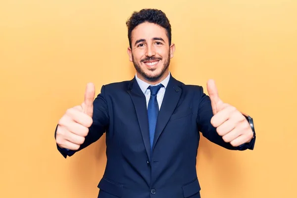 Young Hispanic Man Wearing Suit Approving Doing Positive Gesture Hand — Stock Photo, Image