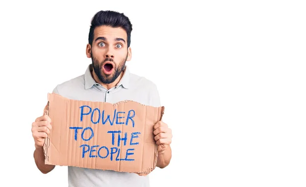 Young Handsome Man Beard Holding Power People Cardboard Banner Scared — Stock Photo, Image