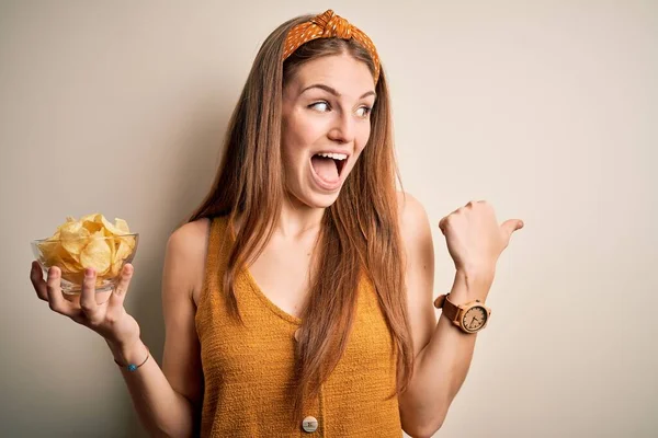 Young Beautiful Redhead Woman Holding Bowl Potato Chips Isolated White — Stock Photo, Image