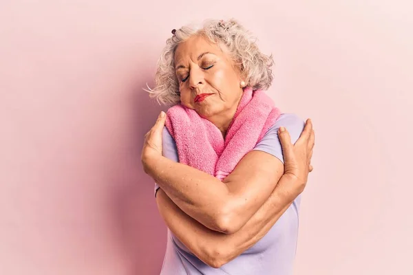Senior Grey Haired Woman Wearing Sportswear Towel Hugging Oneself Happy — Stock Photo, Image
