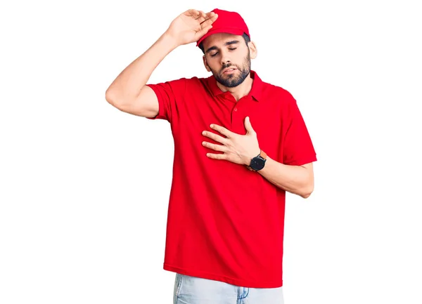 Joven Hombre Guapo Con Barba Llevando Uniforme Parto Tocando Frente —  Fotos de Stock