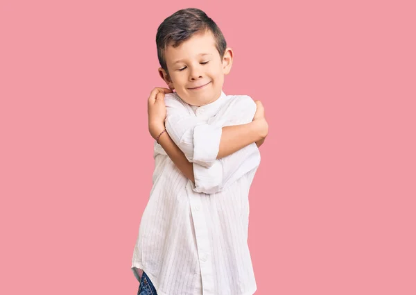 Cute Blond Kid Wearing Elegant Shirt Hugging Oneself Happy Positive — Stock Photo, Image