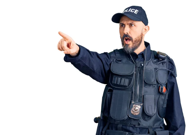 Young Handsome Man Wearing Police Uniform Pointing Finger Surprised Ahead — Stock Photo, Image