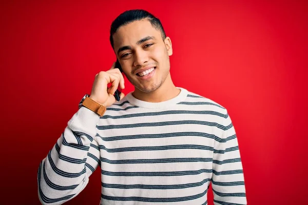 Brazilian Man Having Conversation Talking Smartphone Isolated Red Background Happy — Stock Photo, Image