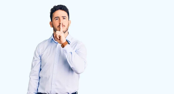 Young Hispanic Man Wearing Business Clothes Asking Quiet Finger Lips — Stock Photo, Image