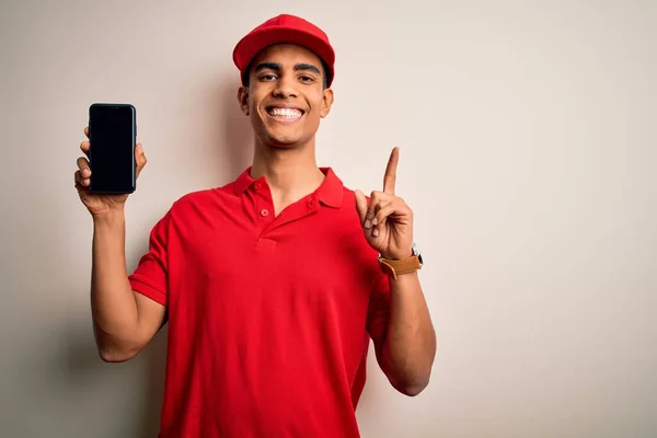 Young Handsome African American Delivery Man Holding Smartphone Showing Screen — Stock Photo, Image