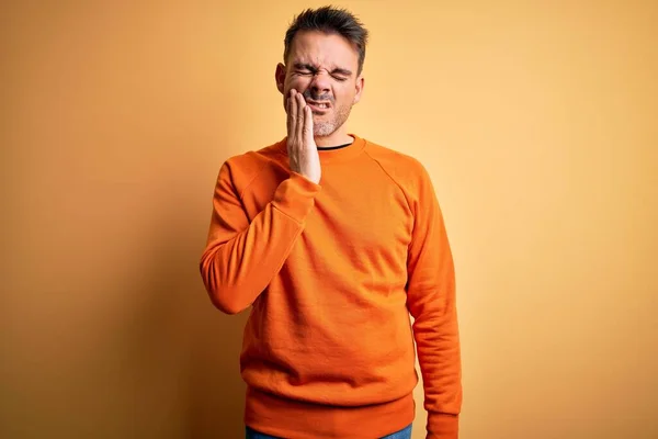 Young Handsome Man Wearing Orange Casual Sweater Standing Isolated Yellow — Stock Photo, Image