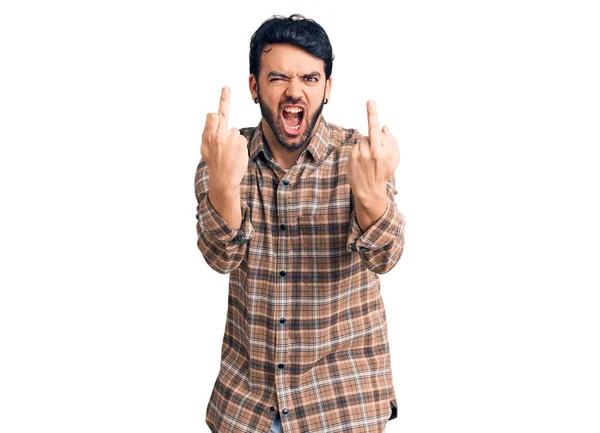 Young Hispanic Man Wearing Casual Clothes Showing Middle Finger Doing — 图库照片