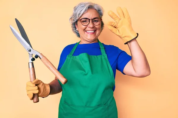 Senior Hispanic Woman Wearing Gardener Apron Gloves Holding Shears Doing — Stock Photo, Image