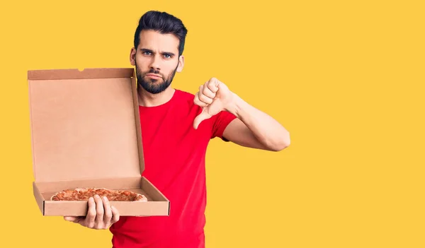 Young Handsome Man Beard Holding Delivery Cardboard Italian Pizza Angry — Stock Photo, Image