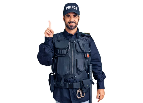 Young Hispanic Man Wearing Police Uniform Pointing Finger Successful Idea — Stock Photo, Image