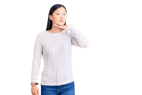 Young Beautiful Chinese Woman Wearing Casual Sweater Cutting Throat Hand — Stock Photo, Image