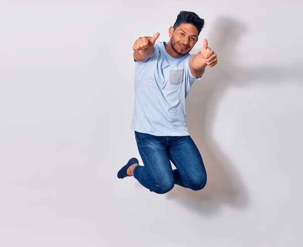 Young Handsome Latin Man Wearing Casual Clothes Smiling Happy Jumping — Stock Photo, Image