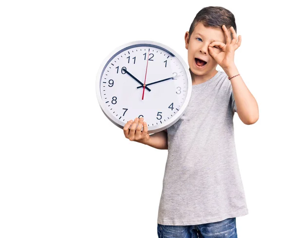 Cute Blond Kid Holding Big Clock Smiling Happy Doing Sign — Stock Photo, Image