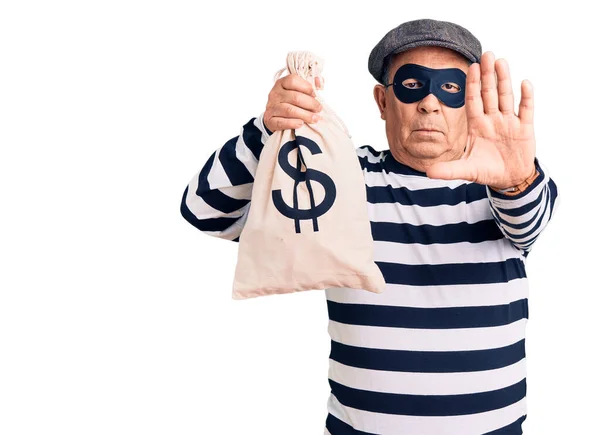 Senior Handsome Man Wearing Burglar Mask Holding Money Bag Open — Stock Photo, Image