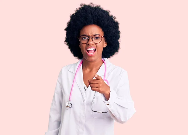 Young African American Woman Wearing Doctor Coat Stethoscope Pointing Displeased — Stock Photo, Image