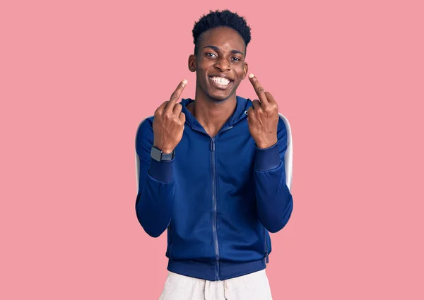 Young African American Man Wearing Sportswear Showing Middle Finger Doing — стоковое фото