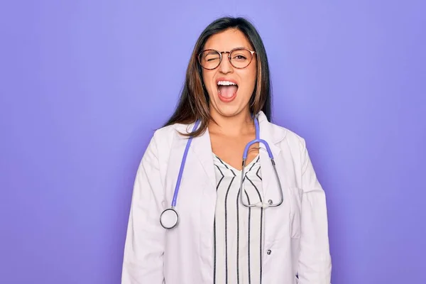 Professional Doctor Woman Wearing Stethoscope Medical Coat Purple Background Winking — Stock Photo, Image