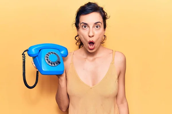 Young Beautiful Hispanic Woman Holding Vintage Telephone Scared Amazed Open — Stock Photo, Image