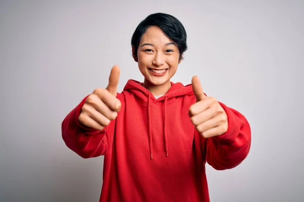 Young Beautiful Asian Girl Wearing Casual Sweatshirt Hoodie White Background — Stock Photo, Image