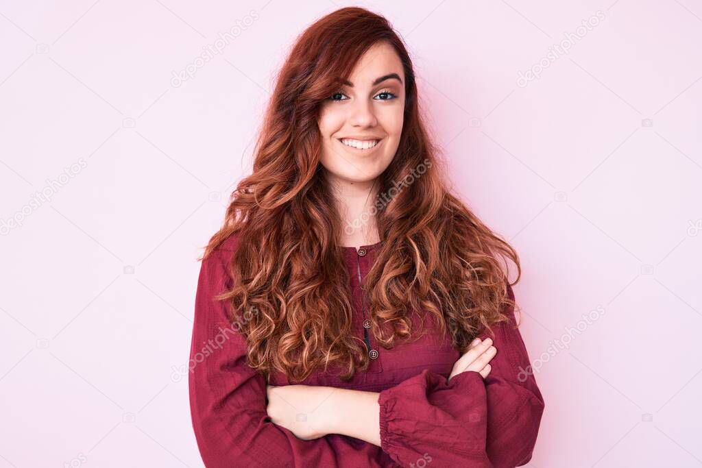 Young beautiful woman wearing casual winter sweater happy face smiling with crossed arms looking at the camera. positive person. 