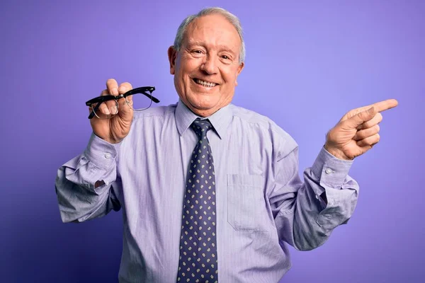 Senior Grey Haired Man Holding Correction Glasses Purple Background Very — Stock Photo, Image