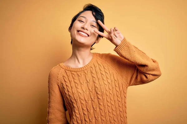 Young Beautiful Asian Girl Wearing Casual Sweater Diadem Standing Yellow — Stock Photo, Image