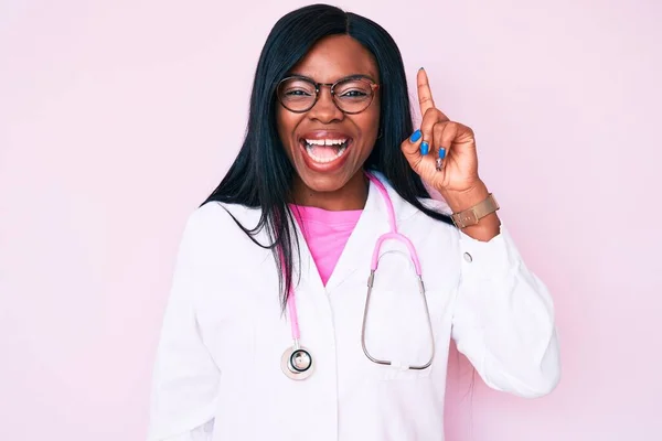 Young African American Woman Wearing Doctor Stethoscope Pointing Finger Successful — Stock Photo, Image
