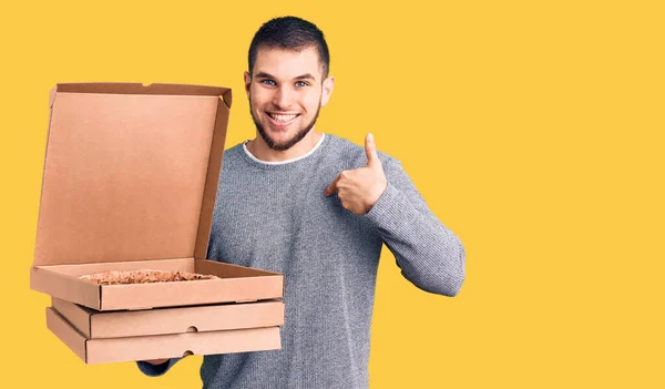 Young Handsome Man Holding Delivery Italian Pizza Boxes Pointing Finger — Stock Photo, Image