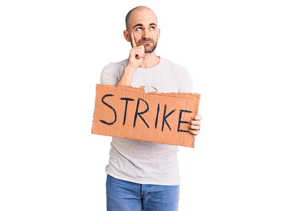 Young Handsome Man Holding Strike Banner Serious Face Thinking Question — Stock Photo, Image