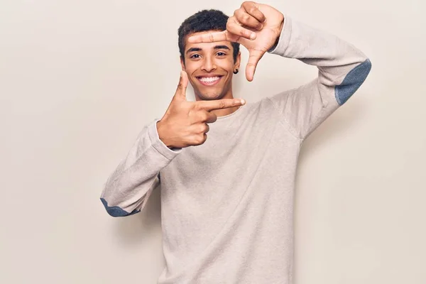 Young African Amercian Man Wearing Casual Clothes Smiling Making Frame — Stock Photo, Image