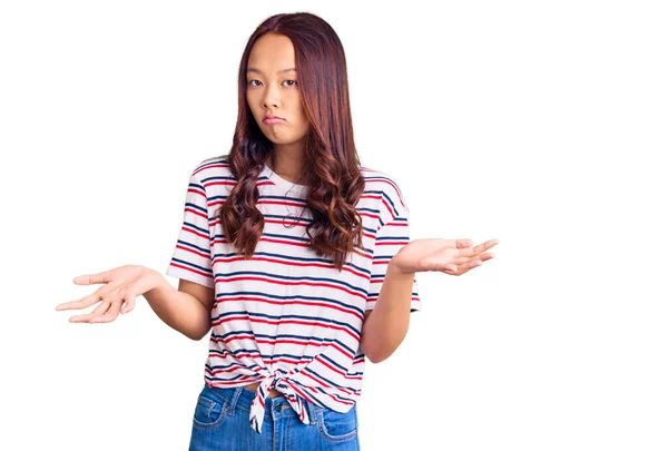 Young Beautiful Chinese Girl Wearing Casual Clothes Clueless Confused Expression — Stock Photo, Image