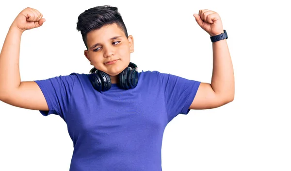 Little Boy Kid Listening Music Wearing Headphones Showing Arms Muscles — Stock Photo, Image