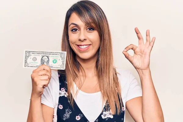 Joven Hermosa Mujer Sosteniendo Dólar Haciendo Signo Con Los Dedos —  Fotos de Stock