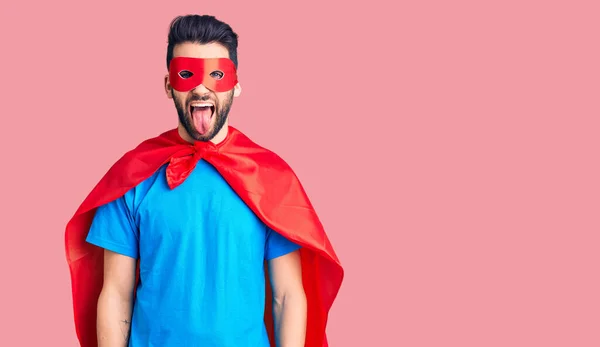 Joven Hombre Guapo Con Barba Usando Traje Superhéroe Sacando Lengua —  Fotos de Stock