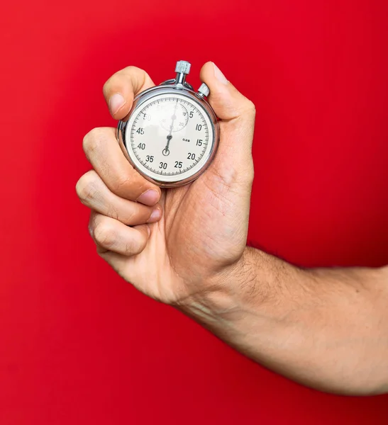 Vacker Hand Man Håller Stoppur Gör Nedräkning Över Isolerad Röd — Stockfoto