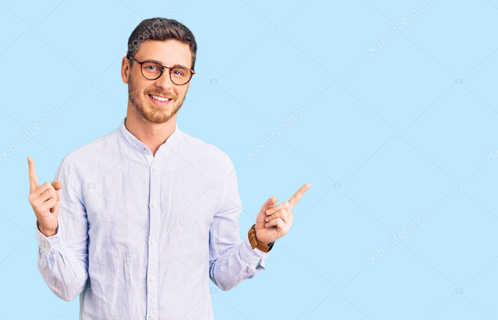 Handsome young man with bear wearing elegant business shirt and glasses smiling confident pointing with fingers to different directions. copy space for advertisement 