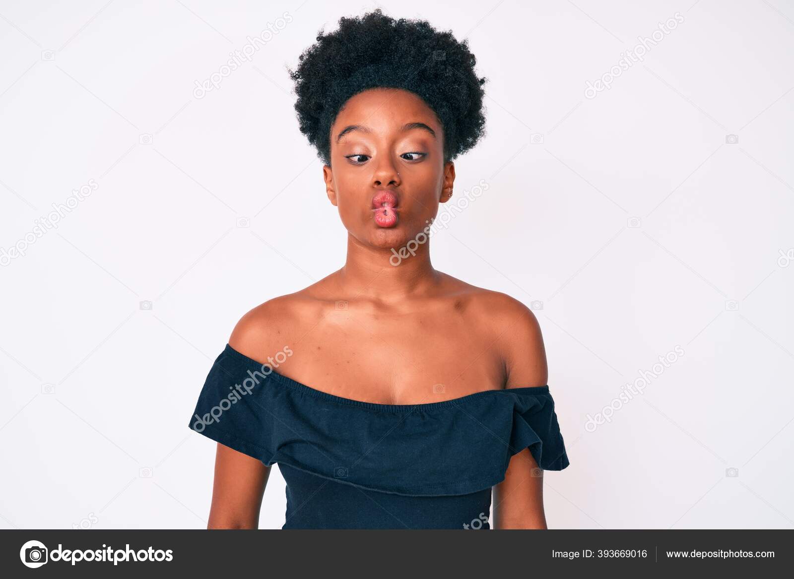 Young African American Woman Wearing Casual Clothes Making Fish