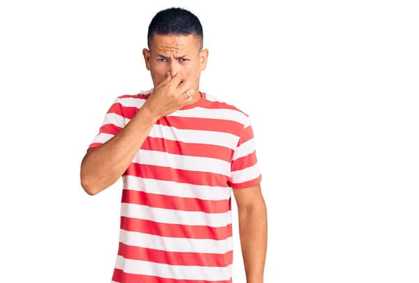 Young Handsome Latin Man Wearing Casual Clothes Smelling Something Stinky — Stock Photo, Image