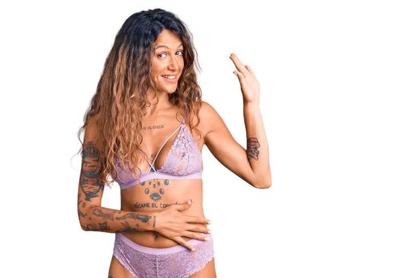 Young Hispanic Woman Tattoo Wearing Lingerie Waiving Saying Hello Happy — Stock Photo, Image