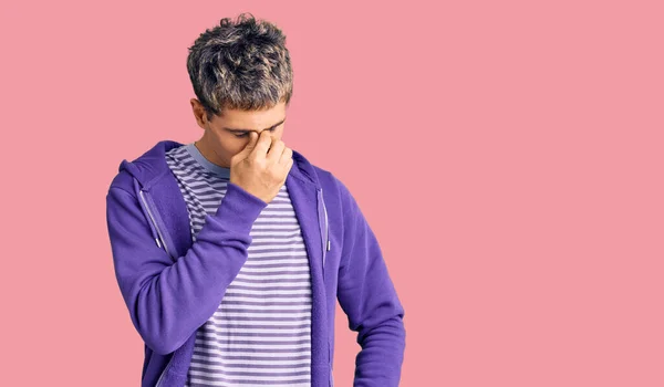 Young Handsome Man Wearing Casual Purple Sweatshirt Tired Rubbing Nose — Stock Photo, Image