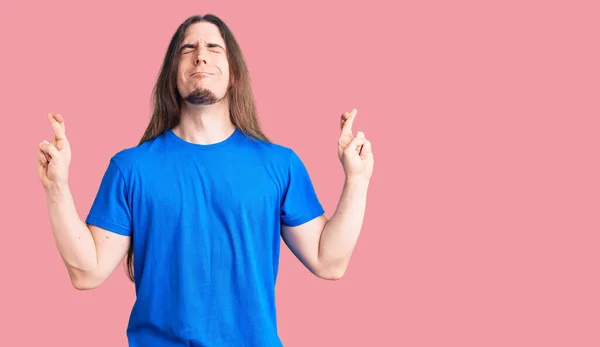 Young Adult Man Long Hair Wearing Swimwear Gesturing Finger Crossed — Stock Photo, Image