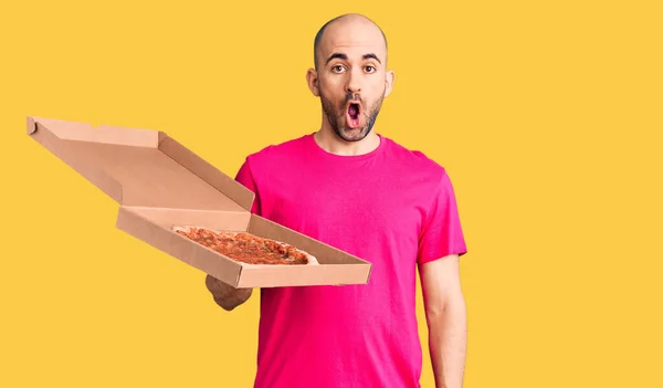 Young Handsome Man Holding Delivery Pizza Cardboard Box Scared Amazed — Stock Photo, Image