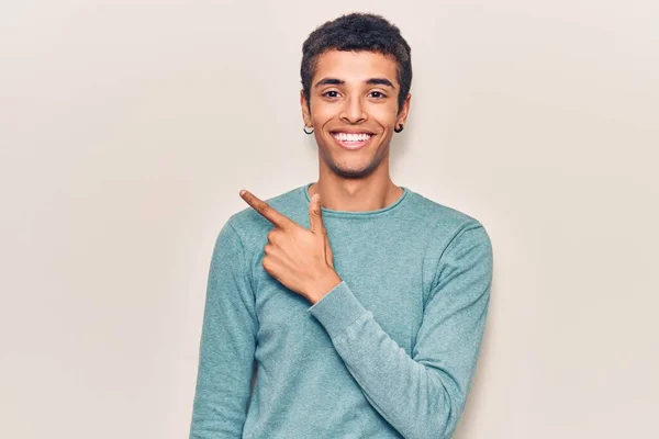 Young African Amercian Man Wearing Casual Clothes Smiling Cheerful Pointing — Stock Photo, Image