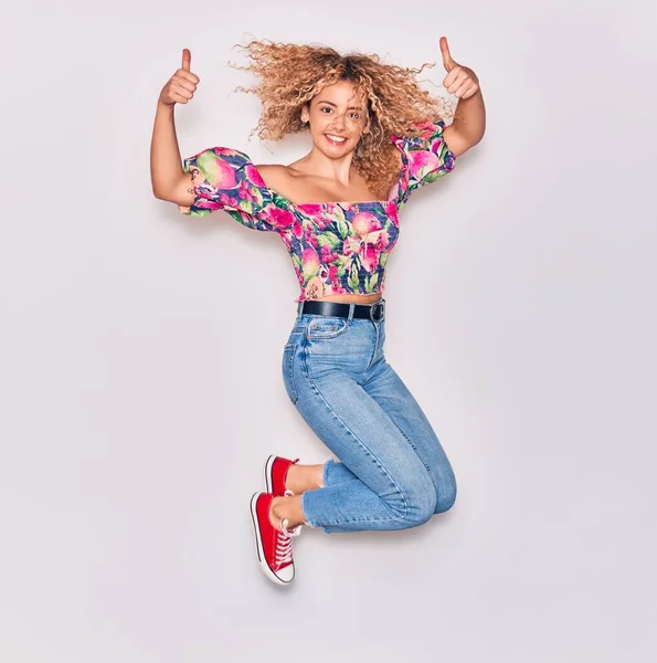 Young Beautiful Curly Girl Wearing Casual Clothes Smiling Happy Jumping — Stock Photo, Image