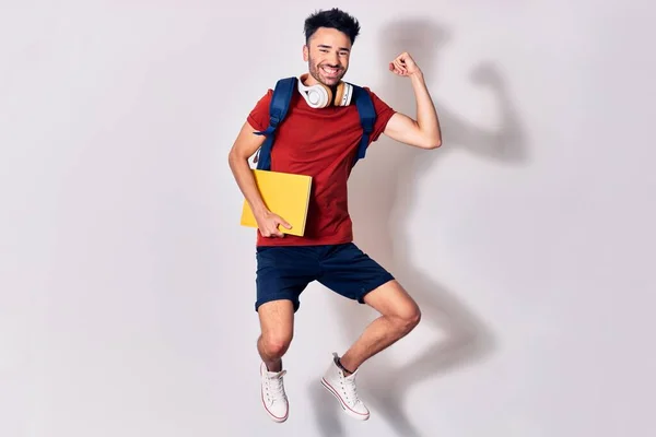 Young Handsome Hispanic Student Man Wearing Backpack Smiling Happy Jumping — Stock Photo, Image