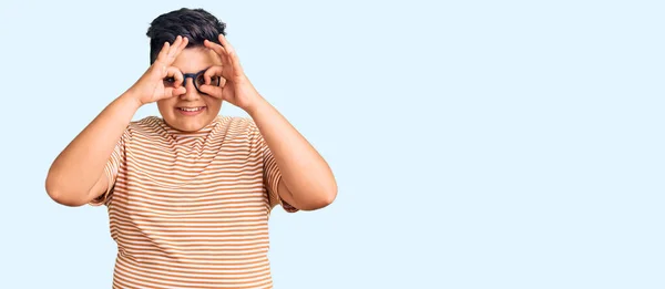 Little Boy Kid Wearing Casual Clothes Glasses Doing Gesture Binoculars — Stock Photo, Image